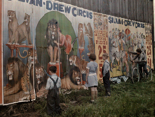 Children read a Sylvan Drew Circus billboard, 1931. Photograph by Jacob J. Gayer, National Geographi