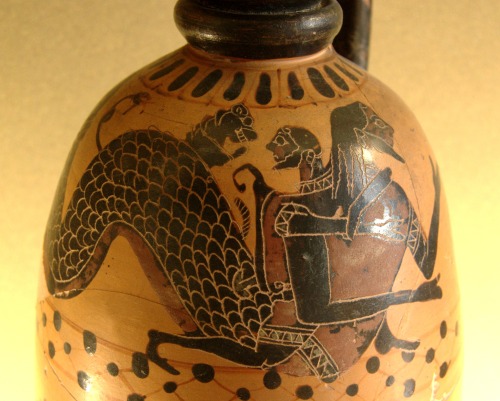 Heracles wrestles the shape-shifting sea god Nereus, trying to force him to reveal the location of t