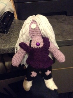 crystal-gems:  nanxaimer:  I made an Amethyst doll! She’s made of Loops &amp; Threads Impeccable yarn and stuffed with polyfil, and her gem is an acrylic rhinestone. However, this doll is a little different from my other projects: she’s for sale!