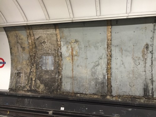 Uncovered wall at Oxford Circus Underground Station, London