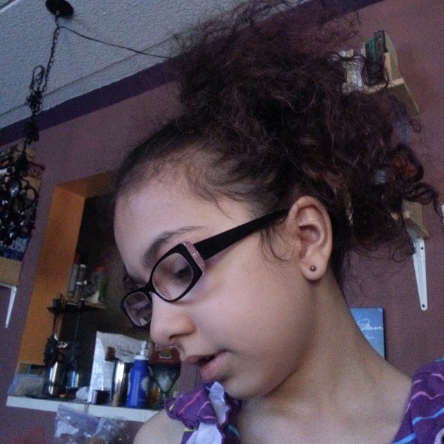 Hair poof using partially combed hair . She liked the style and look but it hurt