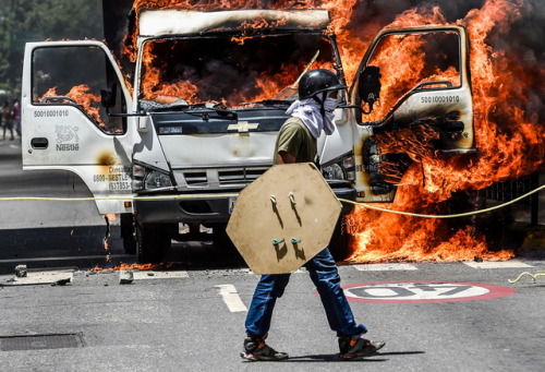 soldiers-of-war: VENEZUELA. Caracas. July 18, 2017. A truck set ablaze by opposition activists blocks an avenue during a protest. The Venezuelan opposition called for a 24-hour national civic strike to pressure President Nicolás Maduro to withdraw the