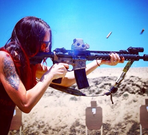 girls with sexy guns . and a weapon suns out guns out .