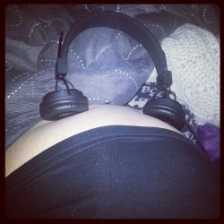 winkingdaisys:  trying to calm my wiggle worm down shes unaware that im trying to sleep!! (: #bump #headphones #random #pale #nosleepforthewicked  This baby is going to be happy with its early meals!!!!!!! BOOOOOBS!