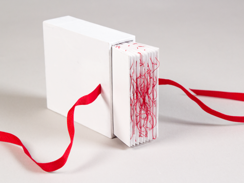 justpieit:  shihfu:  An old project from last year. One of a set of three. To extract the book from its box, both ends of the ribbons must be pulled at once. Pulling only one will get nowhere. Two people connected by the red string of fate are destined