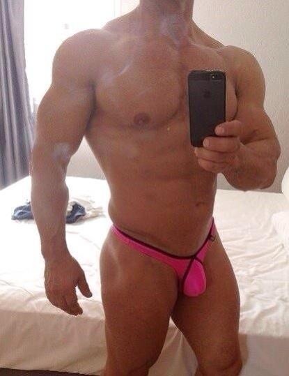 manthongsnstrings:  the pink poser   nice bulge - extremely muscular and awesome looking pecs and nips - WOOF