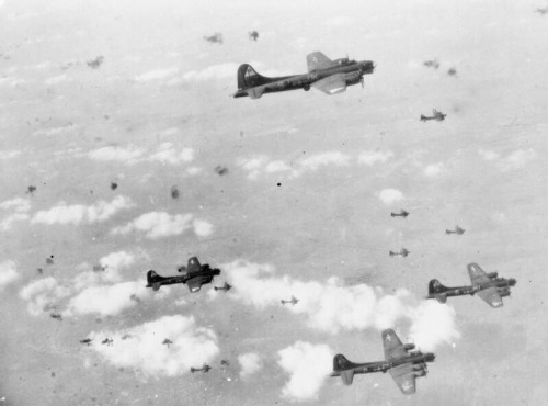 operationbarbarossa:B-17 Flying Fortresses of the US Eighth Air Force pass through a flak-filled sky