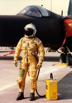 31262:  TR-1A crew wear this David Clark S-1033 full pressure suit for protection at altitude. The yellow box is the portable oxygen supply, used prior to linking up to the aircraft systems.