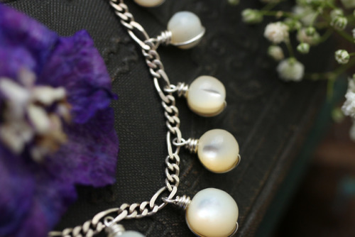 Antique white rosary mother of pearl beads made into an elegant sterling silver necklace.Available a