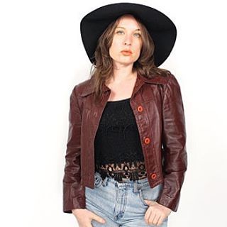 Vintage 70s cropped leather jacket. Jacket buttons up with a fitted shape l, rust brown leather, and