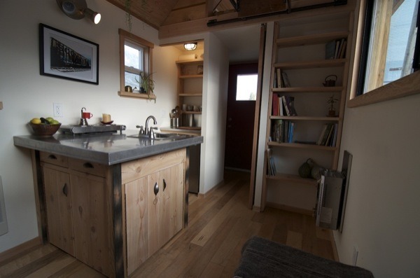 riddick09:  The Acorn tiny house is 14′ by 8.5′ with a covered front porch and