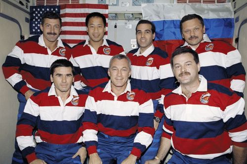 The STS-106 crew pose for a photograph during their mission