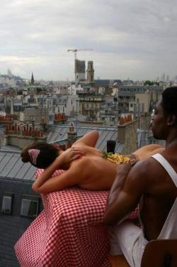 blazepress:  Eddie Murphy eating steak and fries off the back of a model. Somewhere in Europe from 1985. 