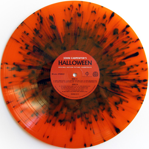 stevesrecords:  John Carpenter ‎– Halloween  Mondo, 2013  **Edition of 1,000 copies with alternate artwork on orange translucent vinyl with black splatter. See the original artwork here.