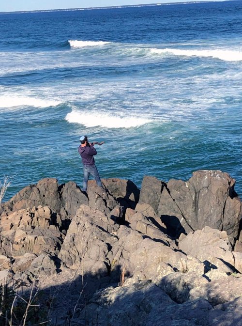 divinum-pacis:A man blows a shofar to celebrate the end of Rosh Hashanah on the Marginal Way, Sunday