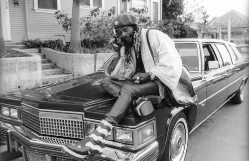 George Clinton of Parliament-Funkadelic sitting on a Cadillac limousine in Hollywood, 1977. Photos b