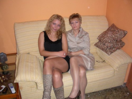 Mature and her daughter posing in sheer pantyhose.Woman in pantyhose