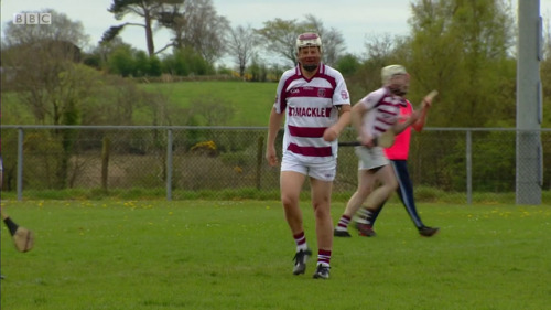 Adrian Chiles playing a game of hurling in “Christine & Adrian’s Friendship Test” s1e02