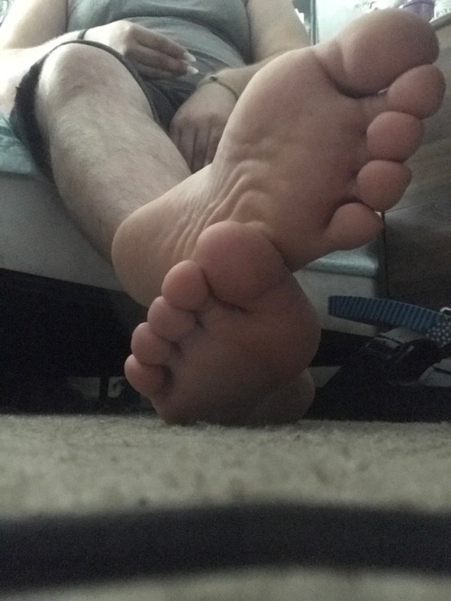 How does it feel to be under my big feet? On second thought, no talking. Just get to licking.