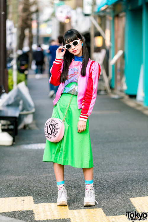 15-year-old Japanese student Yoh on the street in Harajuku wearing a pink satin jacket by The Mighty