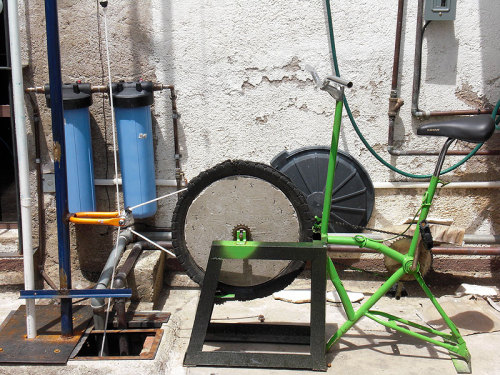 Bicycle + Water out of reach + Inventiveness = Bicycle Water Pump! What else can you make a bicycle into?