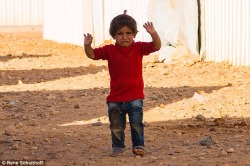 kidscorpio:  greeneyes-anddimples:  isthereaguideforthis:  yunggulabjamoon:  ahmedwong:  A Red Cross worker has pictured another Syrian girl (pictured) in a refugee camp in Jordan who became scared and raised her arms to surrender after mistaking his