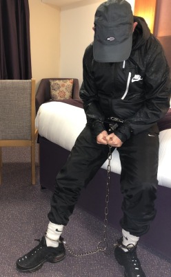 chainedupscallylad: Just been arrested in the hotel, they put the handcuffs and blue box thing on first then wrapped a chain around my tracksuit jacket and padlocked my now handcuffed hands to the chain, they then put another bloody chain that dangled