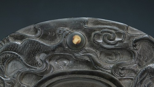  A Chinese Antique Duan Ink Stone: of rounded rectangular form, well carved with motifs of drag