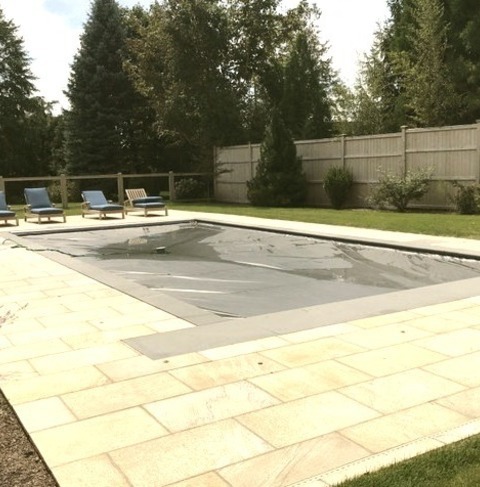 New York Contemporary PoolExample Of A Mid-sized Trendy Side Yard Stone And Rectangular Pool Landscaping