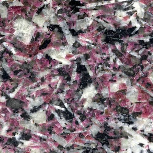 Eudialyte syeniteIsn’t that a delightful color? The mineral with the strong color is Eudialyte
