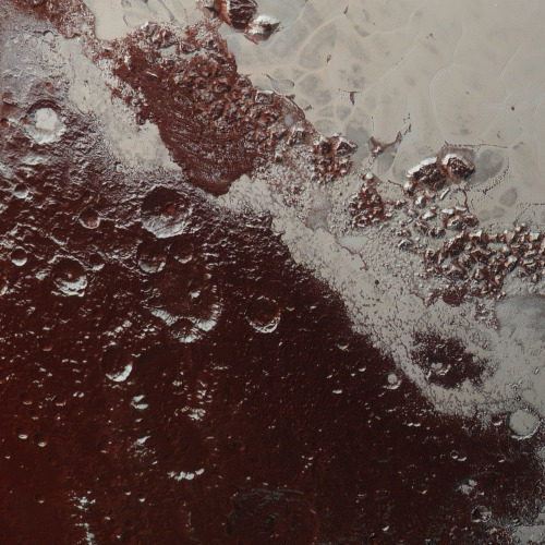 skunkbear:This is one slice of an incredible high resolution, enhanced color image of Pluto, recently released by NASA. 
