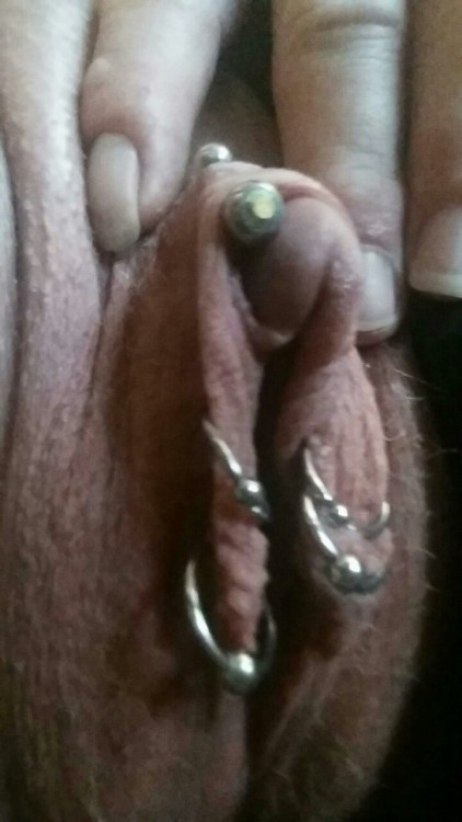 Nice big fat well developed monster pussy. Clit looks like it has been enlarged. Nice slutty piercings too.