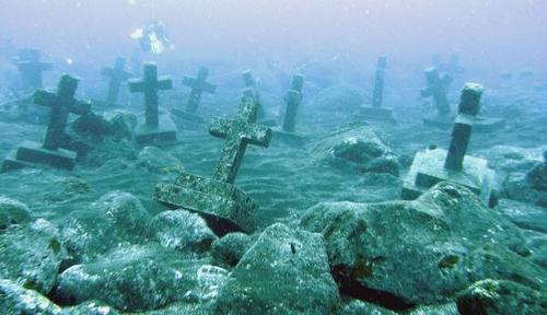 sixpenceee:The whole capital of Camiguin, with its cemetery, sunk under the sea following