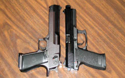 gunrunnerhell:  Substantial Size The easily recognizable Israeli Desert Eagle next to the equally massive German Mark 23 from Heckler &amp; Koch. The Eagle is heavier due to the mostly steel construction whereas the Mark 23 uses a bit more polymer. Price