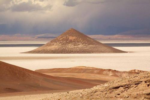 El Cono de Arita Rising up out of the barren salt plain of the Salar de Arizaro in Argentina&rsq