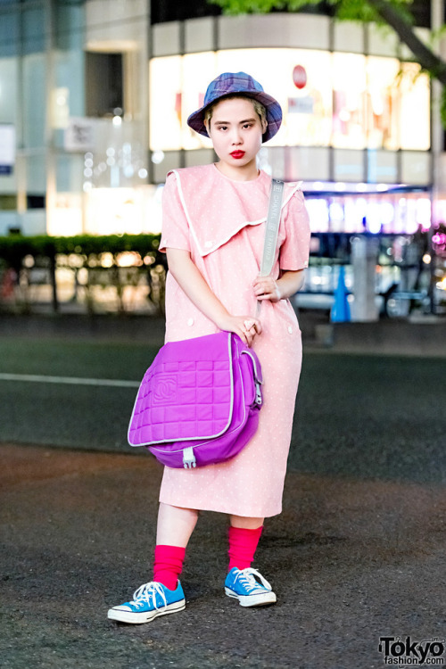 18-year-old Japanese art student Sakurako on the street in Harajuku wearing a vintage polka dot dress, Converse sneakers