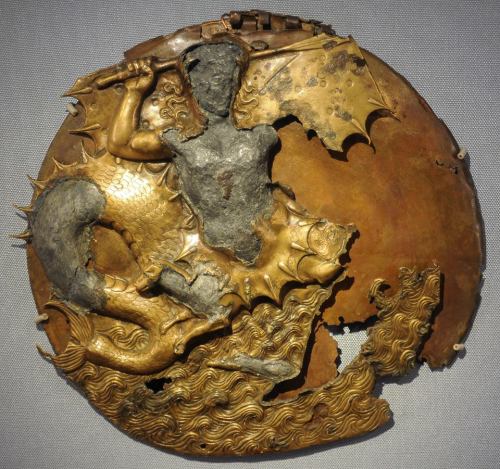 drakontomalloi:Unknown Greek artist – Bronze mirror decorated with the figure of Scylla. Betwe