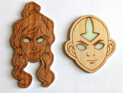 rioburton:  Hey guys! I was experimenting with glowing resin and look what I made! XD I’m so proud of Aang’s symmetrical head. Avatar state badges! 