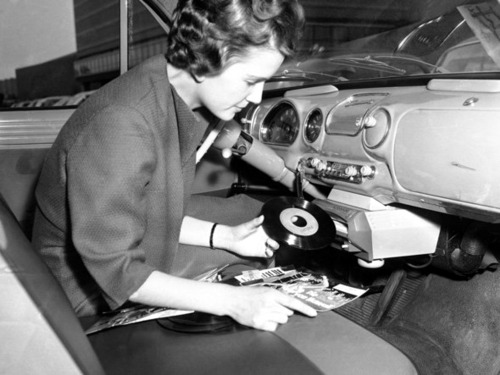 Vintage photographs of a time when cars had vinyl record players. See more here…