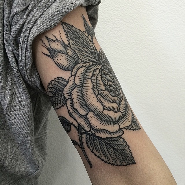 Upper arm rose tattoos for women