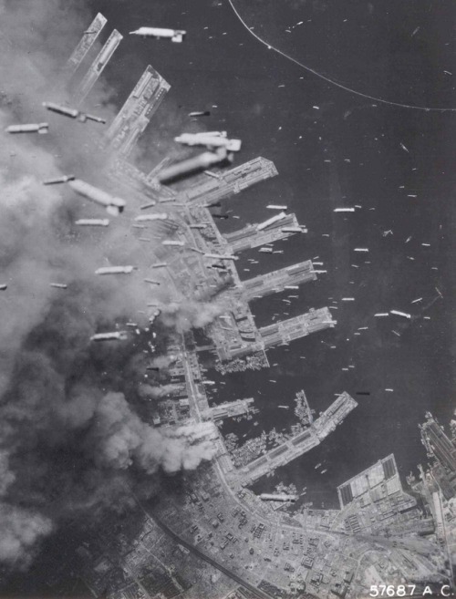 historicaltimes:American bombers droping bombs on docks in Kobe, Japan 1945 via reddit