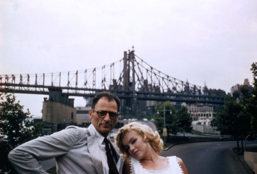 thecinamonroe:  Marilyn Monroe and Arthur Miller in front of the Queensboro Bridge in New York, NY (1957). Photo by Sam Shaw.