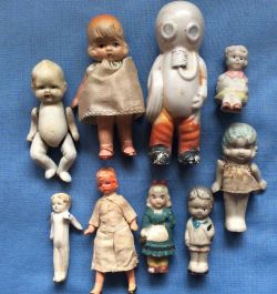 hazedolly: Shabby antique miniature all-bisque doll group. I’m intrigued by the guy in the diving mask. Photo Credit: Ruby Lane shop “Dolls and Smalls”  