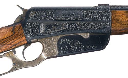 A relief engraved Winchester Model 1895 with walnut stock and British crown proof marks.Sold at Auct