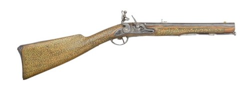 Turkish flintlock carbine with brass scrollwork, early 19th century.from Olympia Auctions