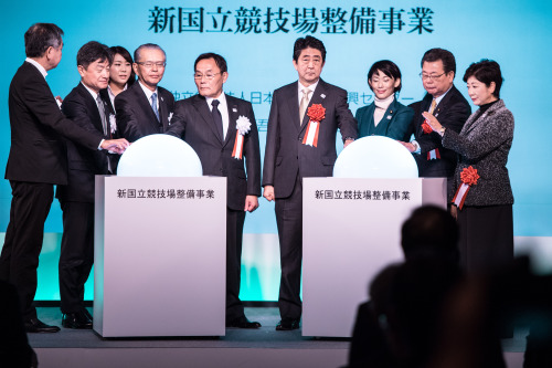 Japanese Prime Minister Shinzo Abe, fourth right, Olympic Minister Tamayo Marukawa, third right, Cab