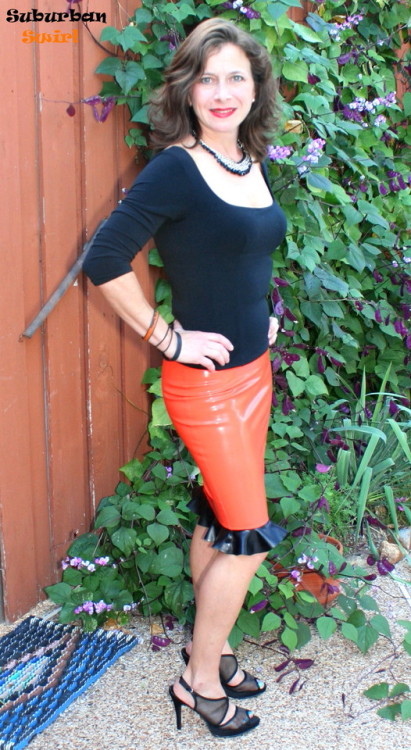 suburbanswirl:Orange custom latex flounce skirt by Audrey at Nimue’s Latex, top by Victoria’s Secret, and mesh peep-toe 