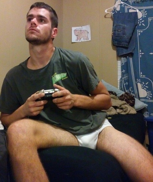 masculinetightywhities: Nothing like playing video games in your briefs.