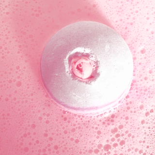Neko stim board with coloured pink, blue, and green with bathbombs, crystals, and slime/floam.