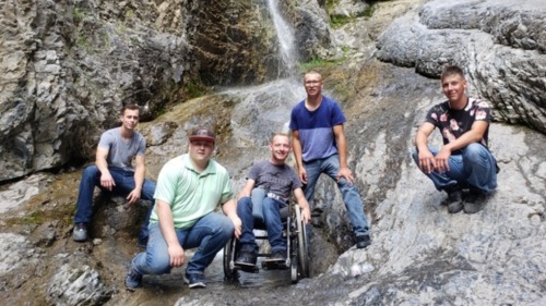 ‘Aaron goes wherever we go’: Friends carry man in wheelchair to view waterfall“At 